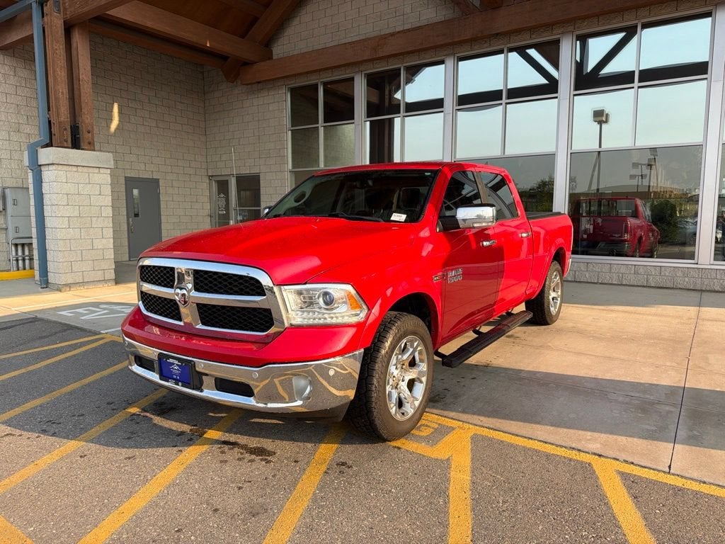 2016 RAM 1500 Laramie in Red — front three-quarter view