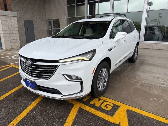 2023 Buick Enclave Essence in Summit White — front three-quarter view